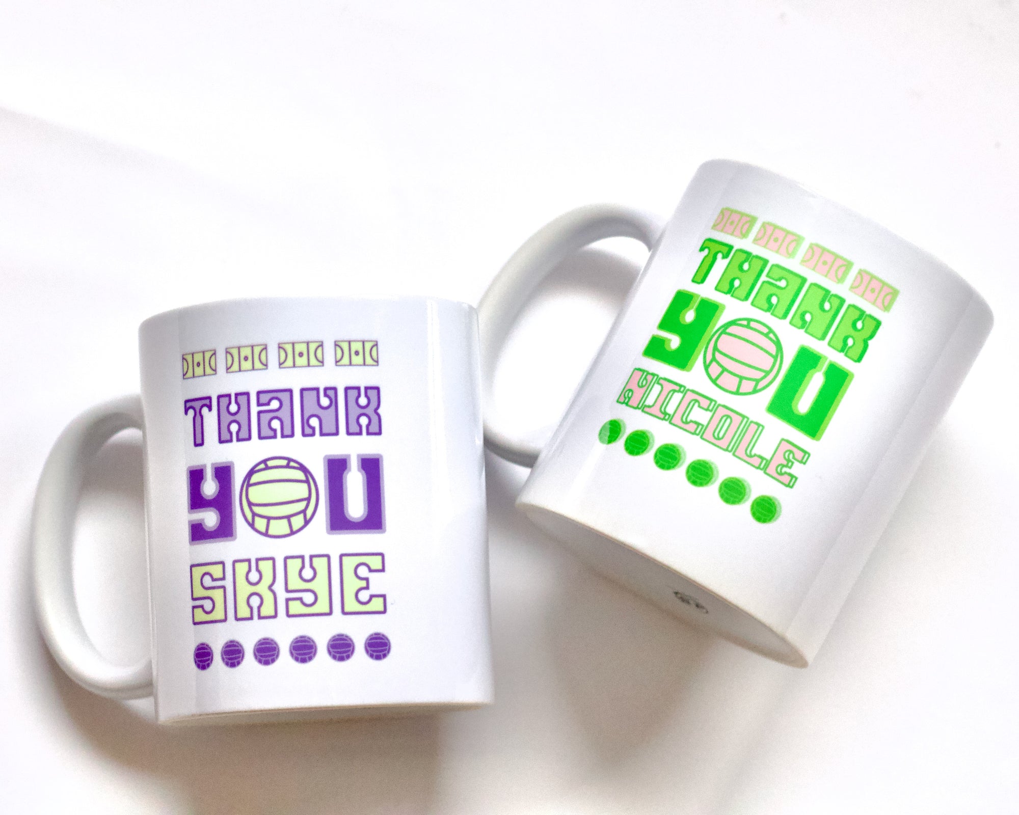 Two netball coach thank you mugs in lime and purple colour schemes featuring fun typography evoking netball courts